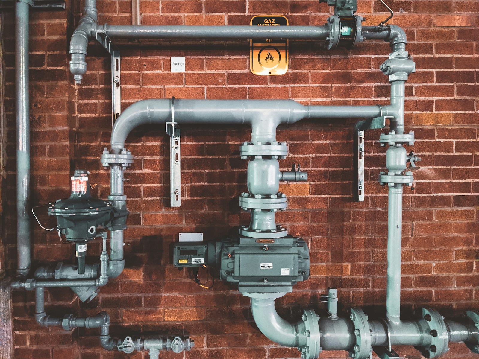 Technician working on residential plumbing fixtures.