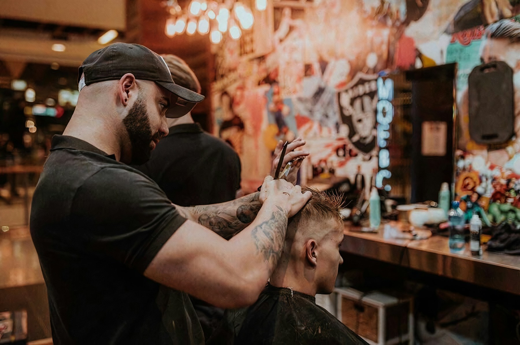 A barber cutting hair at the chair.