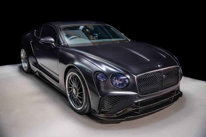 A premium black coupe, studio photographed, representing the Onyx Rides fleet.